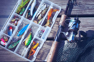 Fishing Lures In Tackle Boxes With Spinning Rod And Net Stock Photo -  Download Image Now - iStock